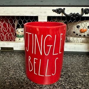 Rae Dunn jingle bells candle displayed for a short time never burned